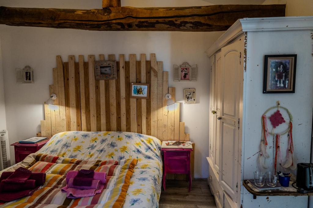 Postel nebo postele na pokoji v ubytování Le Moulin de Pascale