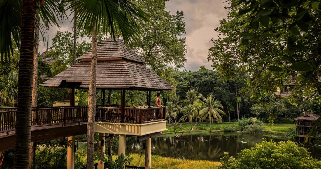 a gazebo in a park with a pond at Four Seasons Resort Chiang Mai in Mae Rim