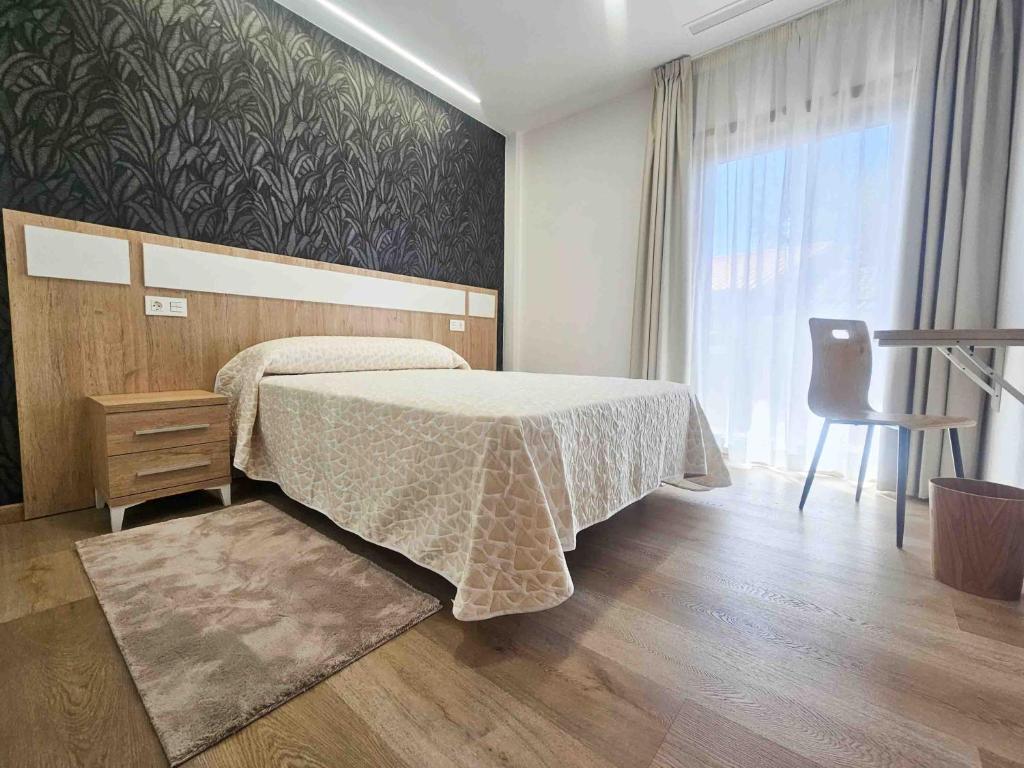 Säng eller sängar i ett rum på A Quinta de Cea - Apartamentos