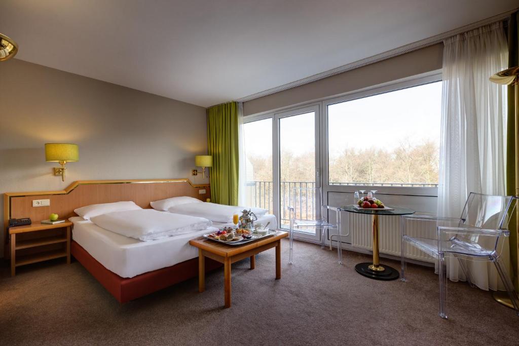 Postel nebo postele na pokoji v ubytování Silva Hotel Spa-Balmoral