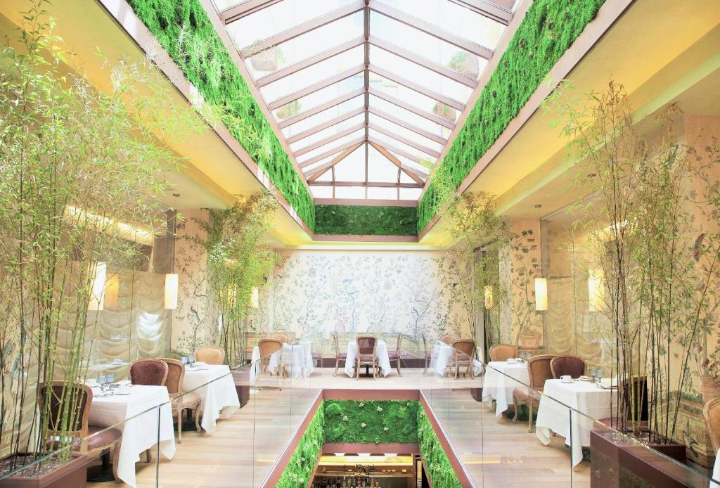 a rendering of a restaurant with a glass ceiling at URSO Hotel & Spa, a Small Luxury Hotel of the World in Madrid