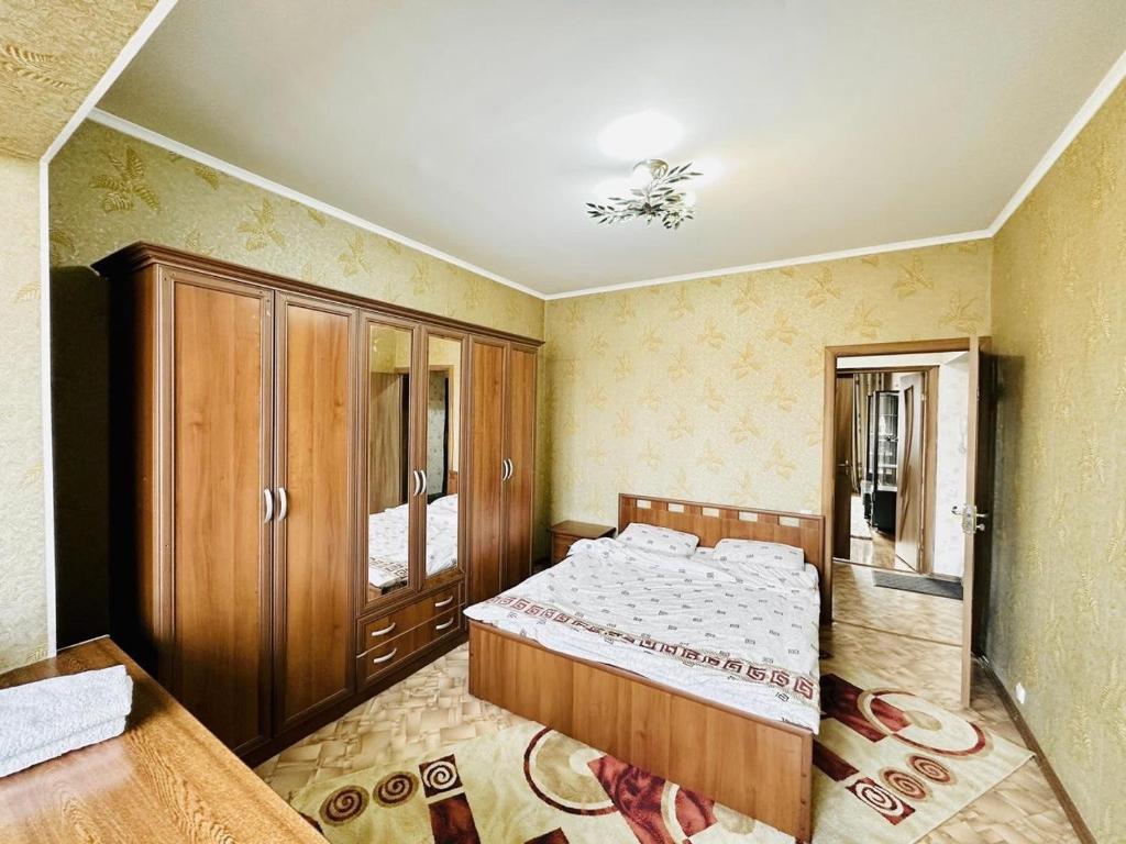 Cama o camas de una habitación en Квартира в центре Бишкека