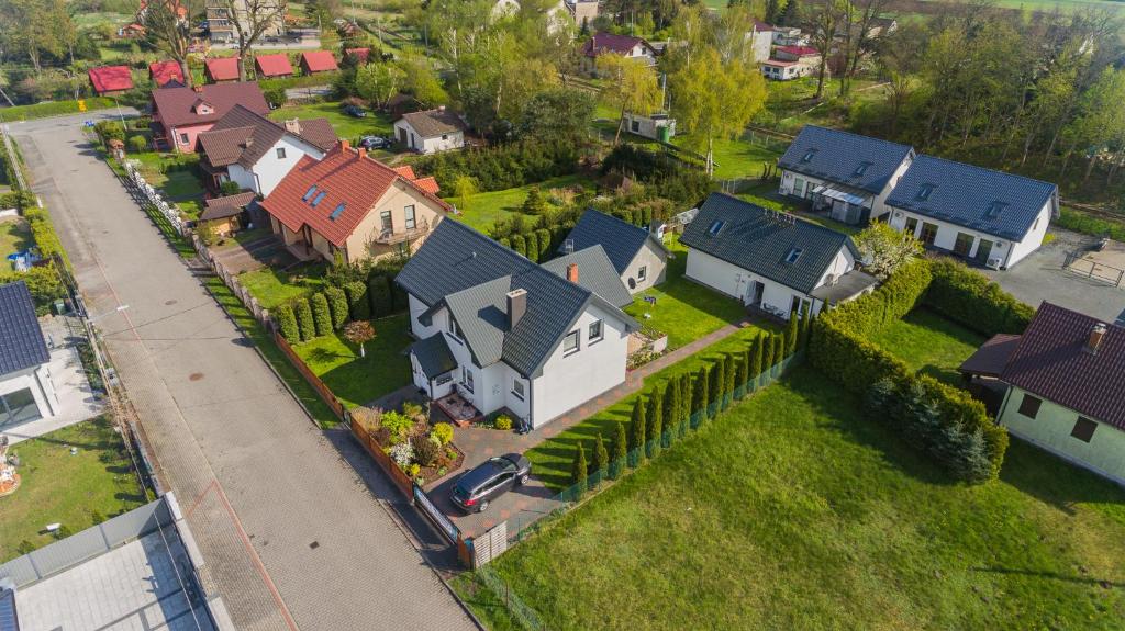 an overhead view of a house in a residential neighborhood at Villa del Sol in Sztutowo