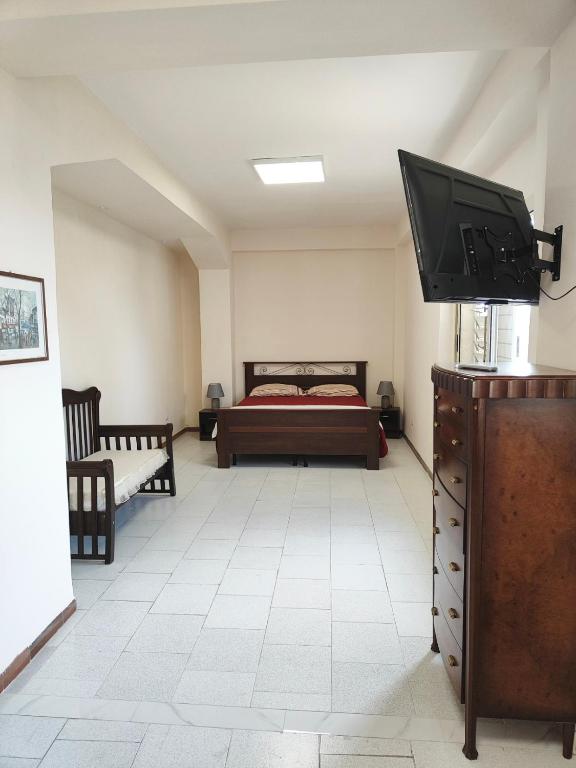 Postel nebo postele na pokoji v ubytování FONDO VERSACE