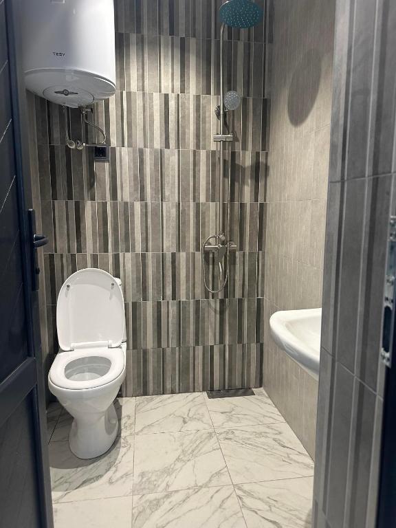 Koupelna v ubytování EVN Rooms