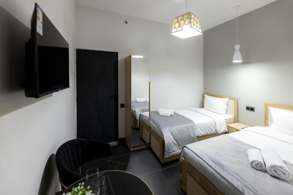 Postel nebo postele na pokoji v ubytování EVN Rooms