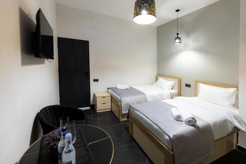 Postel nebo postele na pokoji v ubytování EVN Rooms