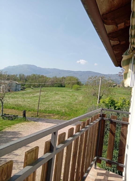 a balcony with a view of a field at La Colombara in Fara Vicentino
