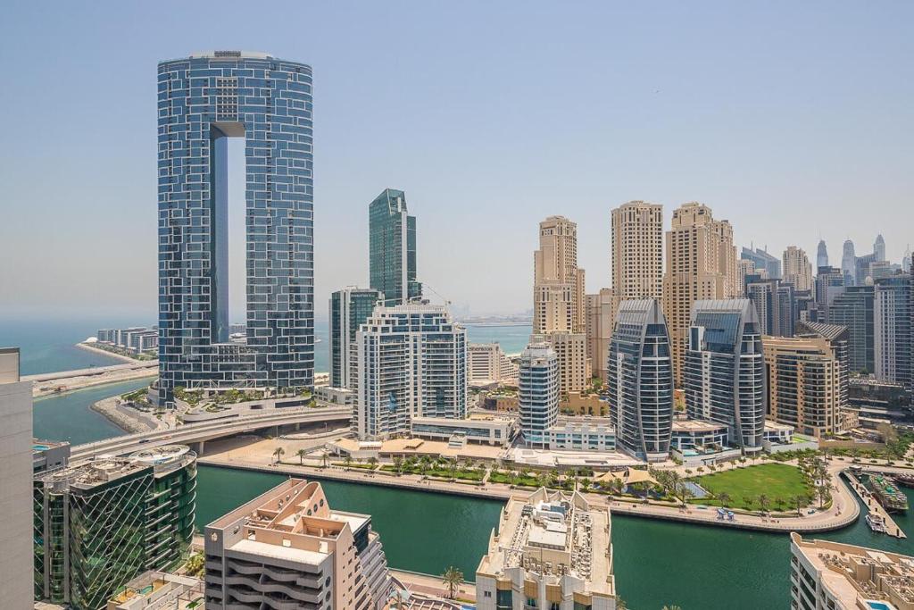 an aerial view of a city with tall buildings at Frank Porter - Studio One in Dubai