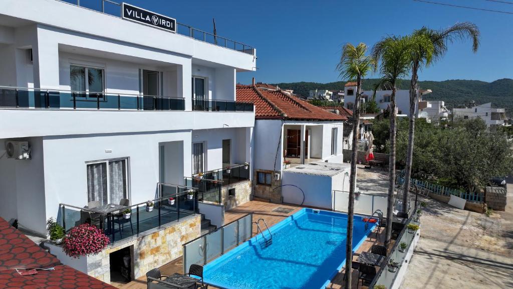 an apartment with a swimming pool in a building at Vila Irdi in Ksamil