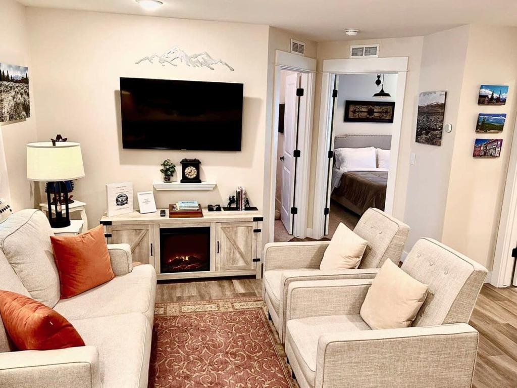 a living room with two couches and a television at Leadville's Copper Top Getaway in Leadville