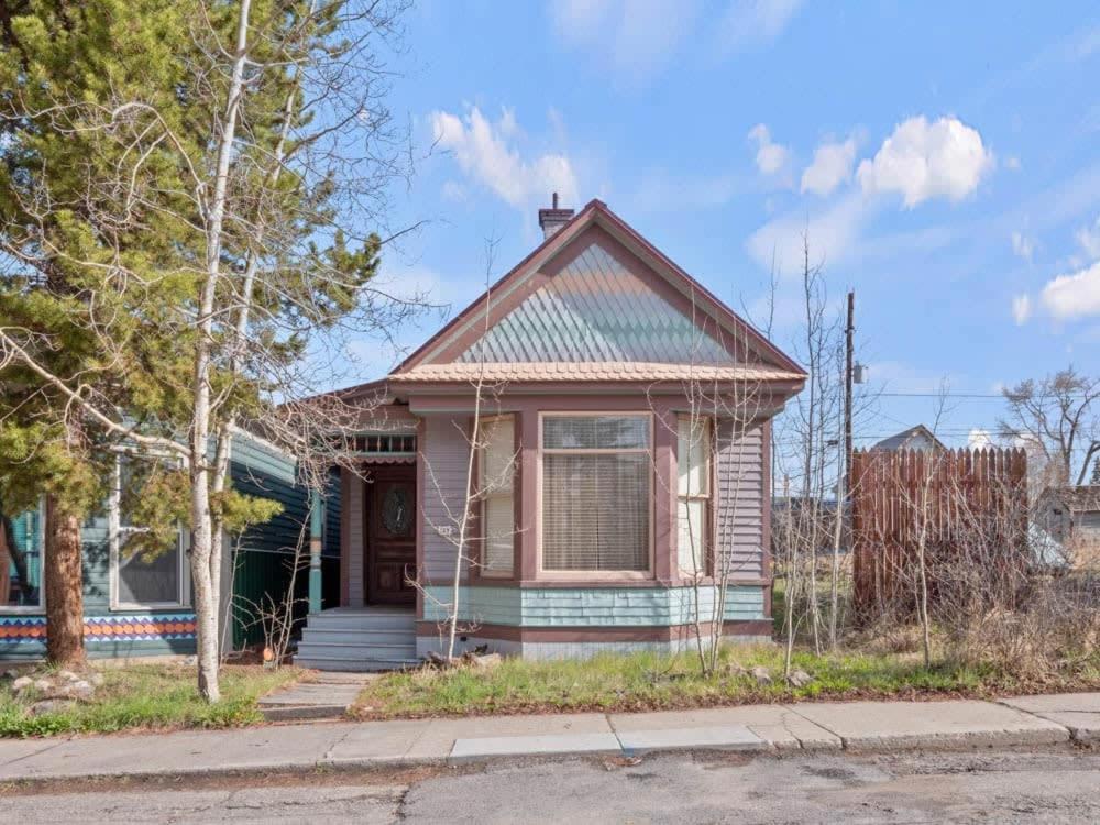 a small house on the side of a street at Painted Lady in Leadville