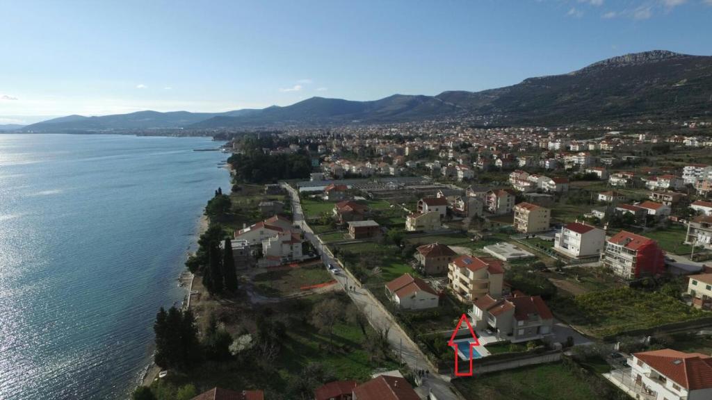 an aerial view of a city next to the water at Apartments Palatium in Kaštela