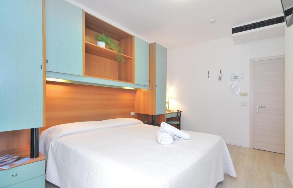 Postel nebo postele na pokoji v ubytování Hotel Rex