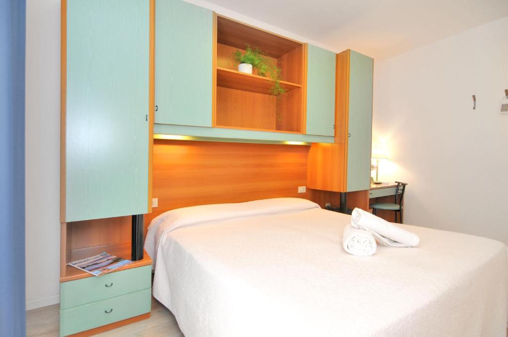 Postel nebo postele na pokoji v ubytování Hotel Rex