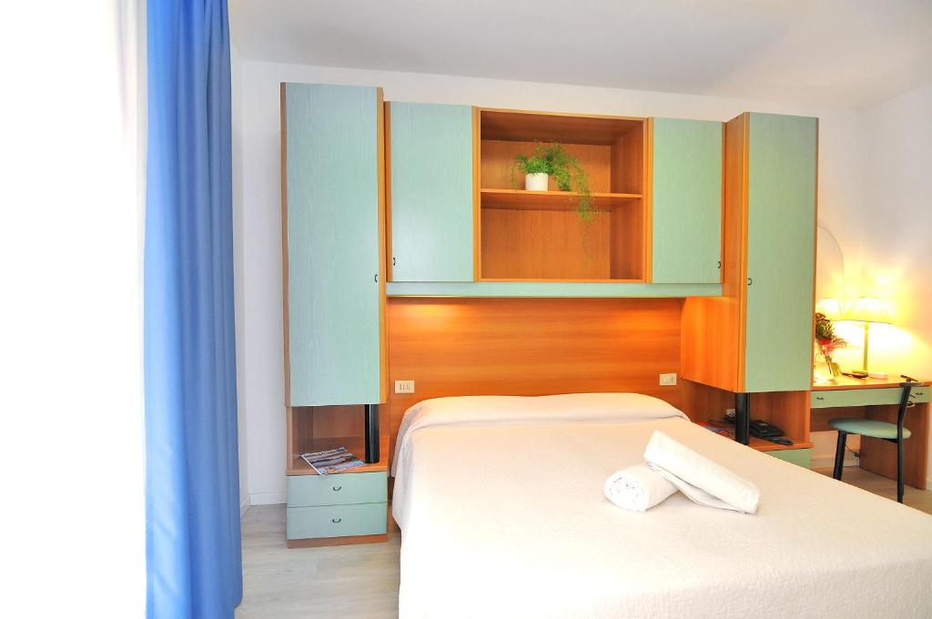 Postel nebo postele na pokoji v ubytování Hotel Rex
