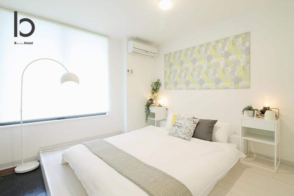 Katil atau katil-katil dalam bilik di Hanagin - Studio apartment for 2 people with free wifi 101