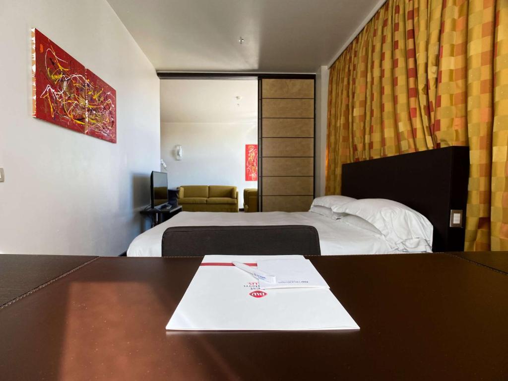 Łóżko lub łóżka w pokoju w obiekcie Best Western Plus Hotel Le Favaglie