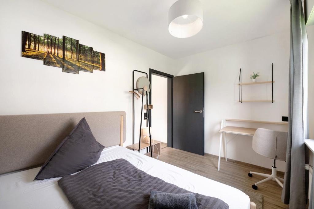 Postel nebo postele na pokoji v ubytování Eifel-resort