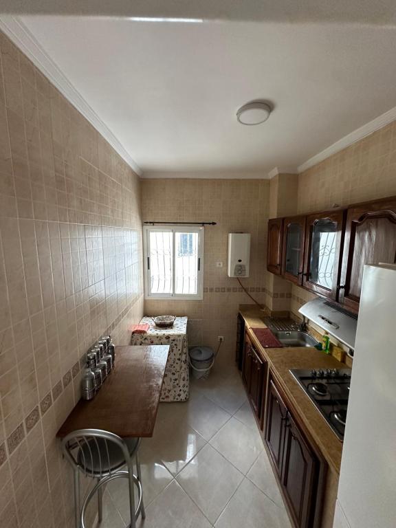 Kuchyň nebo kuchyňský kout v ubytování Appart Firdaous