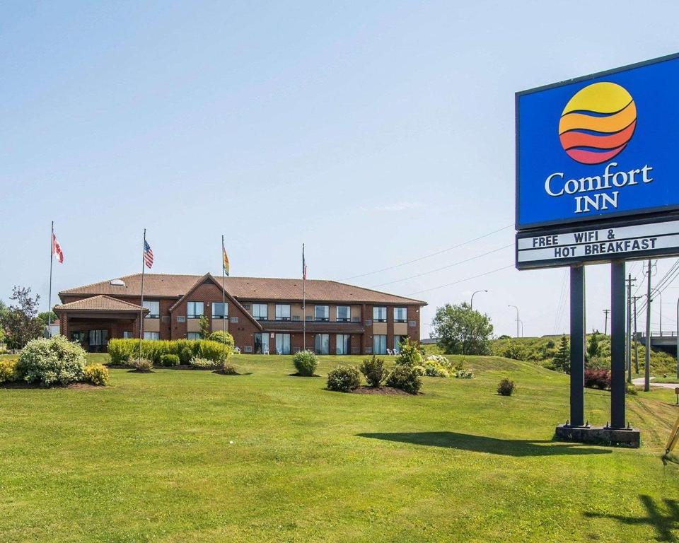 a sign for a comfort inn in front of a building at Comfort Inn Moncton East in Moncton