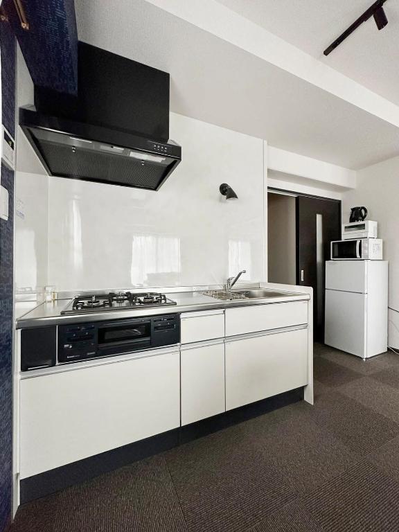 Kuchyň nebo kuchyňský kout v ubytování bHOTEL Nagomi - Large 2BR Apt City Center for 10 Ppl