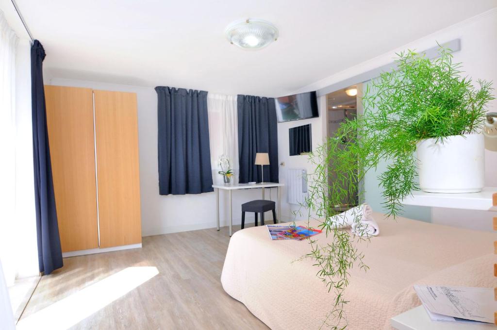 TV a/nebo společenská místnost v ubytování Hotel Rex