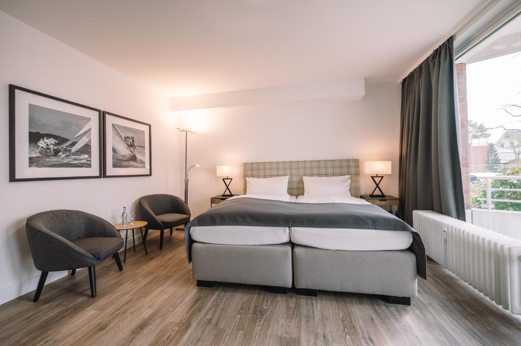 Postel nebo postele na pokoji v ubytování Hotel Royal