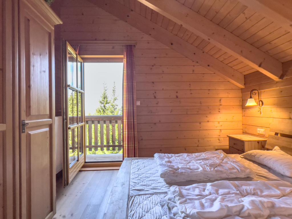 Postel nebo postele na pokoji v ubytování 1A Chalet Enzianhuette - Wandern und Indoor Sauna