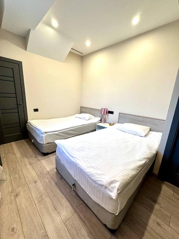 Postel nebo postele na pokoji v ubytování Park Avenue Hotel Yerevan