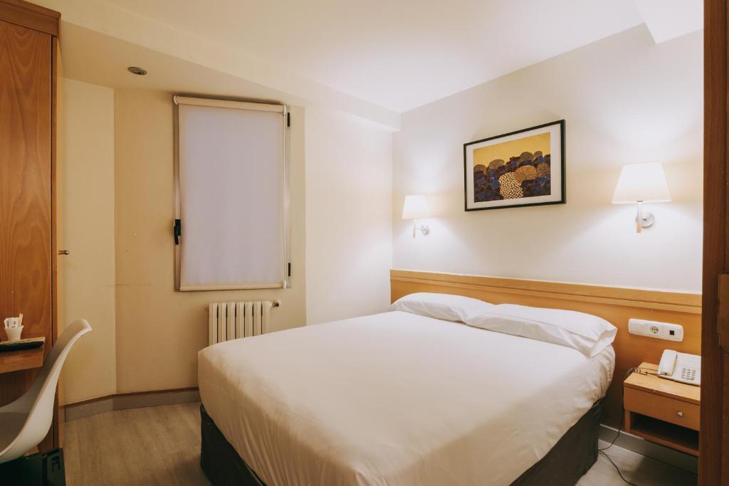 Posteľ alebo postele v izbe v ubytovaní Hotel Zaragoza Plaza