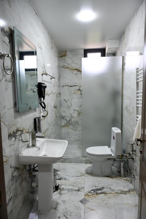 Koupelna v ubytování Hotel K124