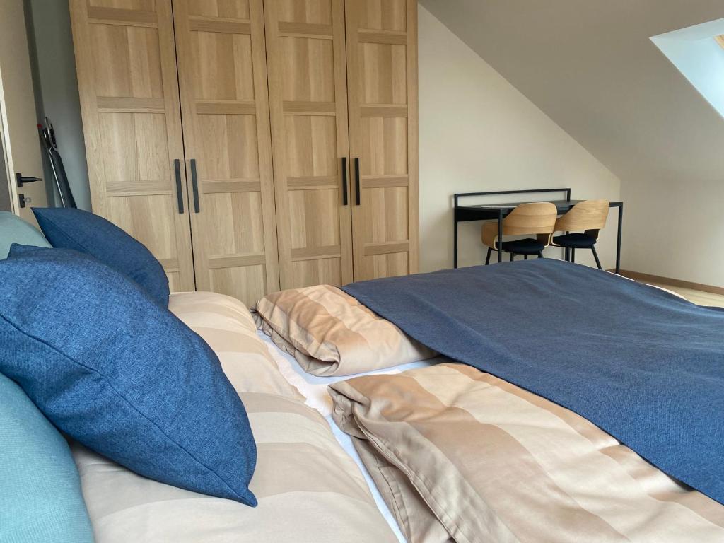 A bed or beds in a room at Zafír Home