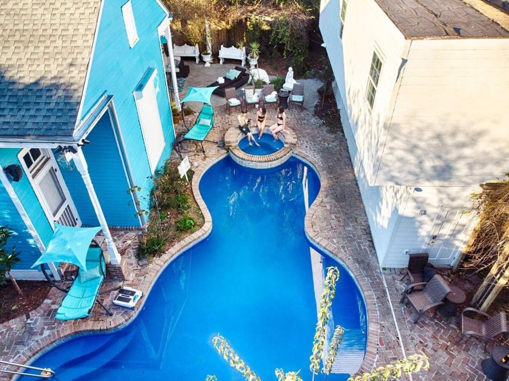 an overhead view of a swimming pool at a resort at 5 BR - Sleeps 8! Steps from Bourbon Street! in New Orleans