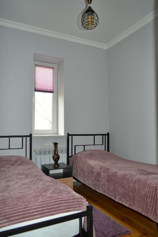 Postel nebo postele na pokoji v ubytování Sunny Lodge Dilijan