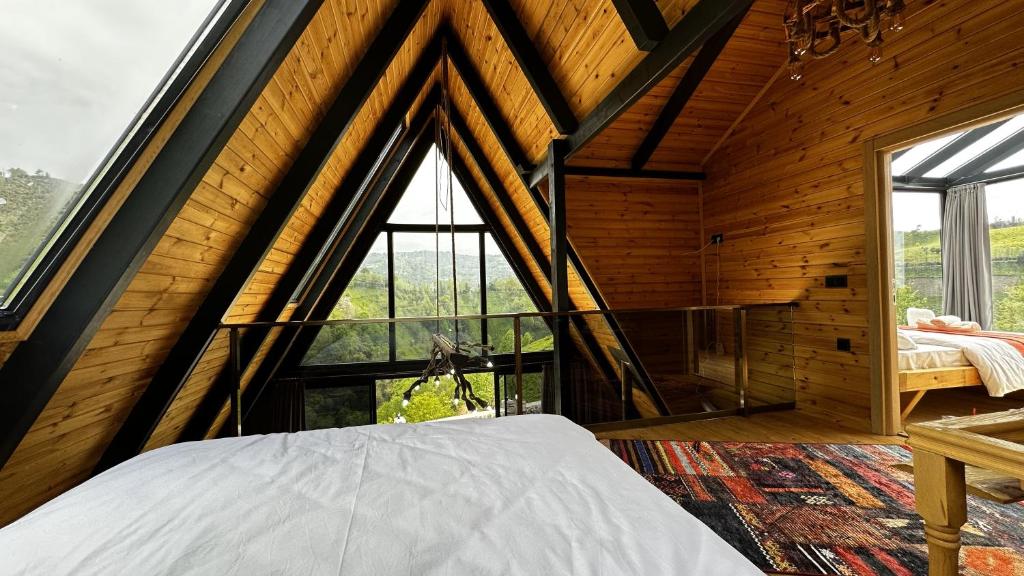 Postel nebo postele na pokoji v ubytování paradise valley bungalow