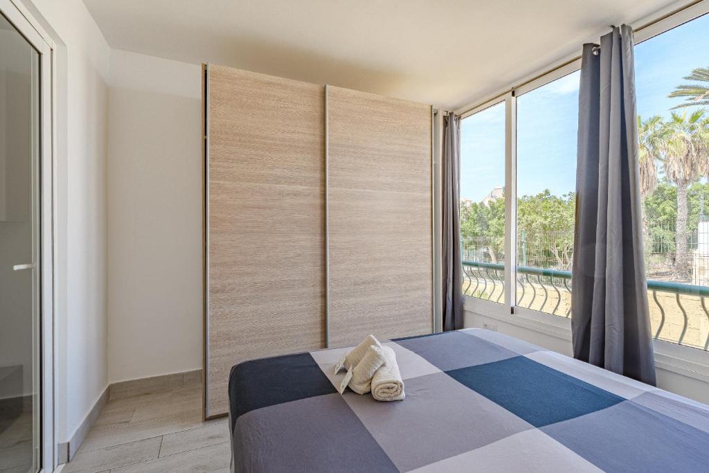 Postel nebo postele na pokoji v ubytování Apartamentos en Torres del Sol
