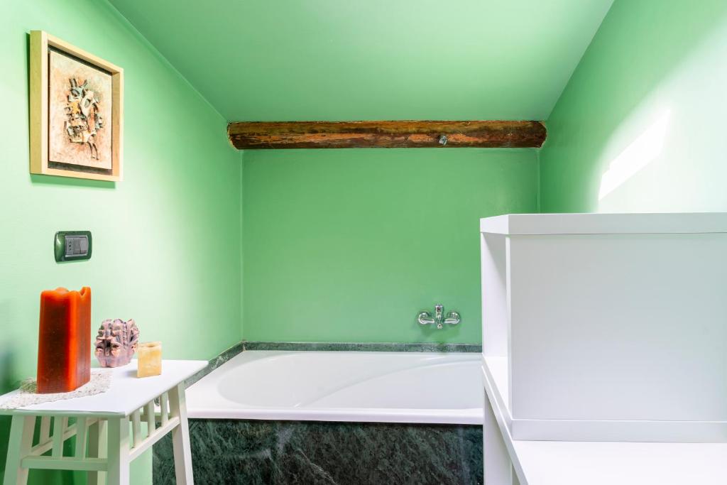 Кровать или кровати в номере Casa Ginevra - 3 Minutes Walk from the Sea