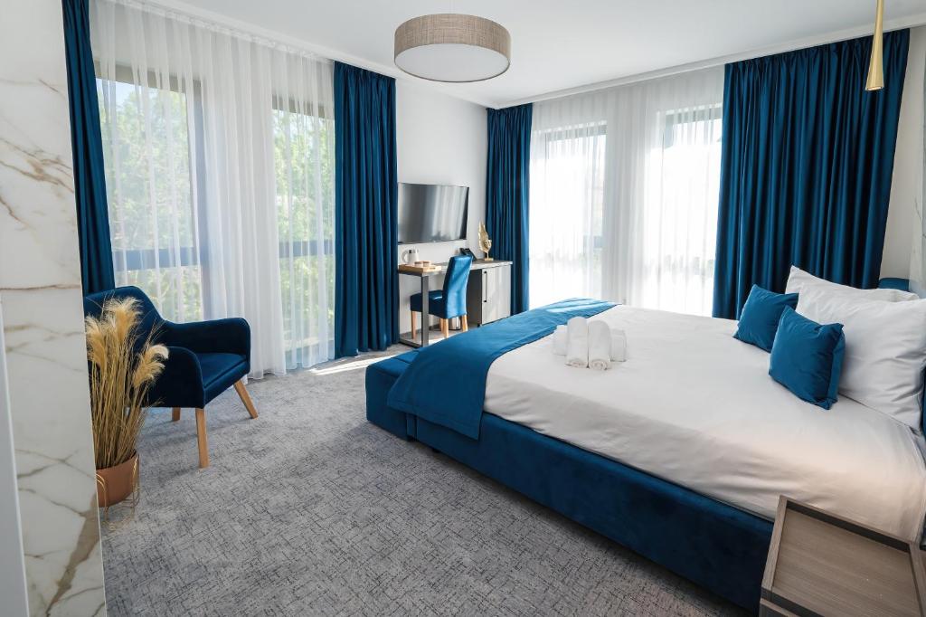 Postel nebo postele na pokoji v ubytování ALIVE HOTEL