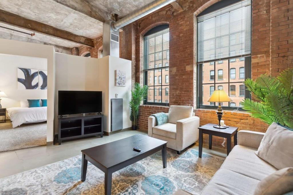 A seating area at 2BR 2BA Historic Loft Retreat With Pool