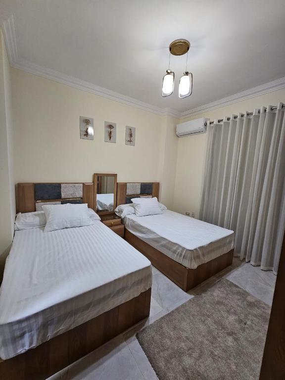 Postel nebo postele na pokoji v ubytování Lovely 2 Bedrooms apartment in New Cairo, Fifth settlement