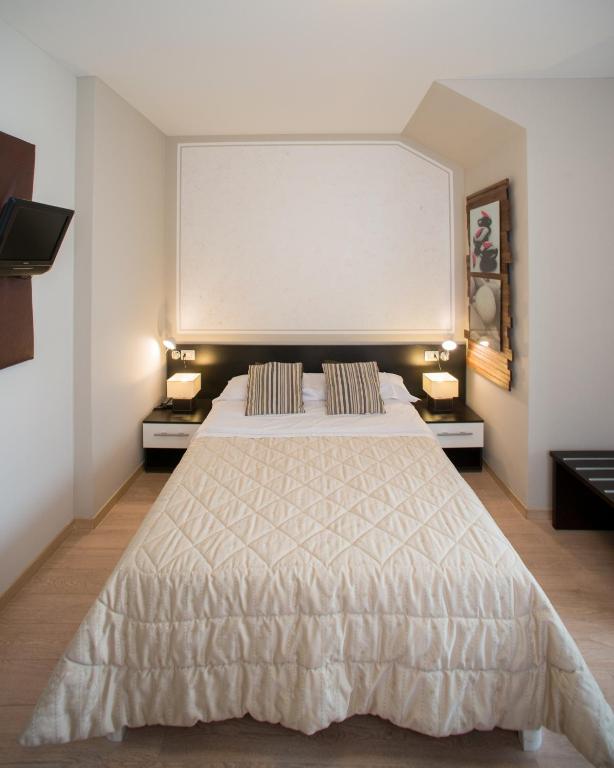 Postel nebo postele na pokoji v ubytování Berghotel