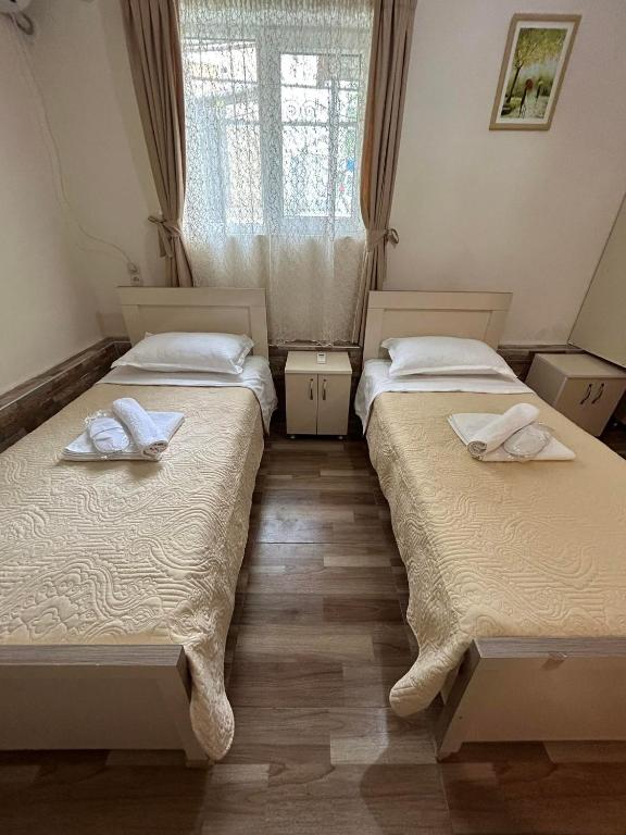 Llit o llits en una habitació de Orchidea Guest House