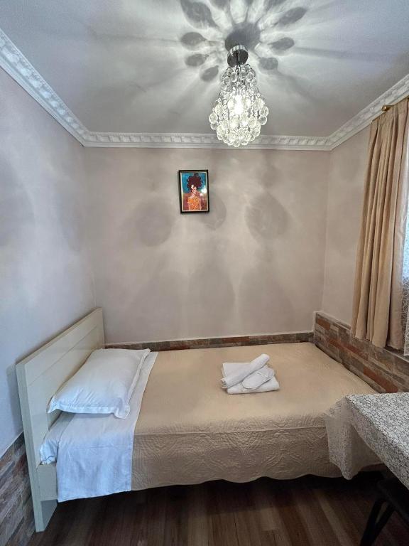 Llit o llits en una habitació de Orchidea Guest House