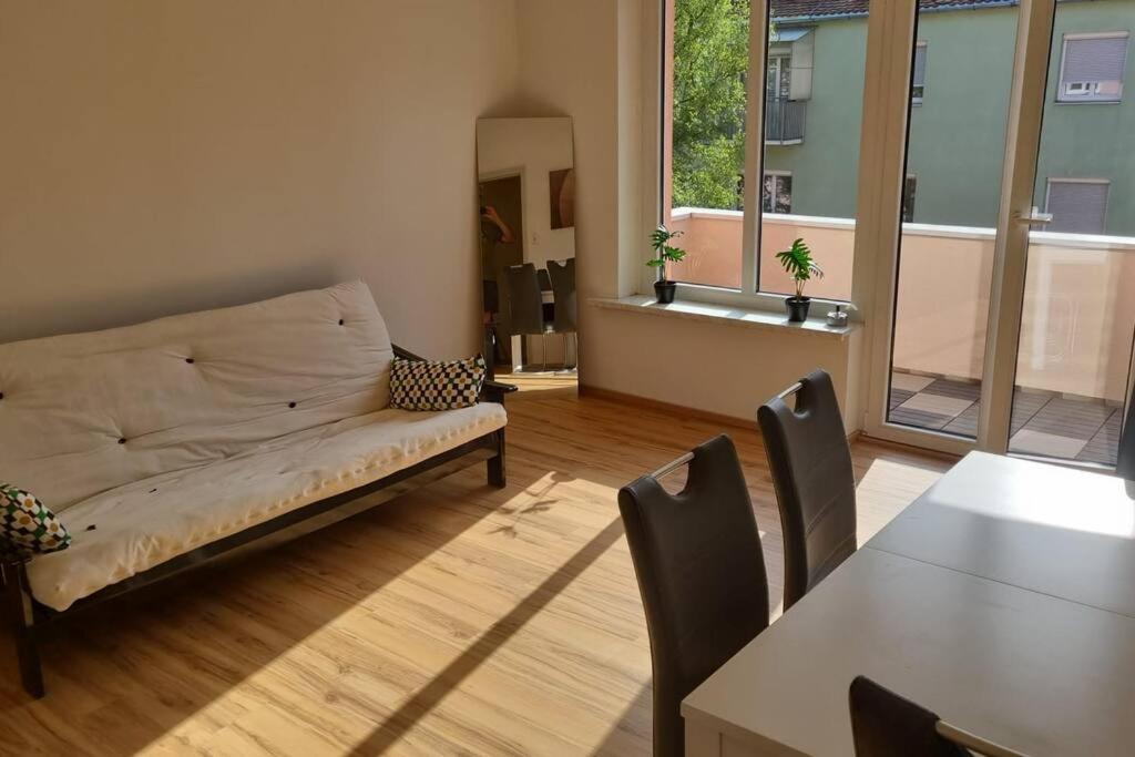 a living room with a couch and a table at Charming flat in a quiet central location in Graz
