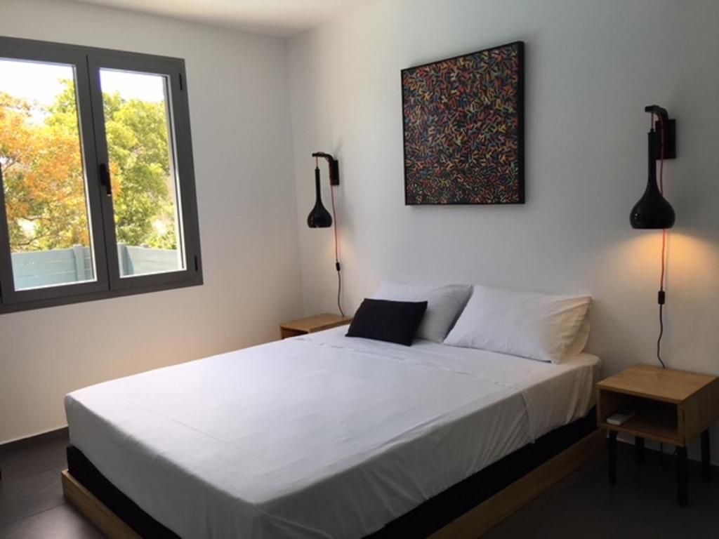 Postel nebo postele na pokoji v ubytování Villa Coco Cannelle