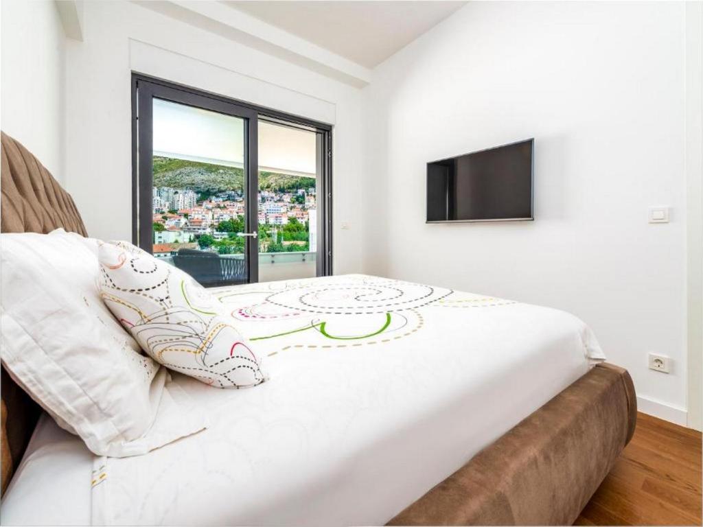 Televízia a/alebo spoločenská miestnosť v ubytovaní Apartment Lara Exclusive