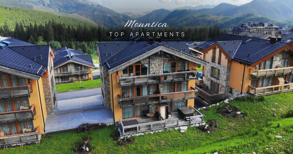 an aerial view of a resort in the mountains at Mountica Jasná in Belá