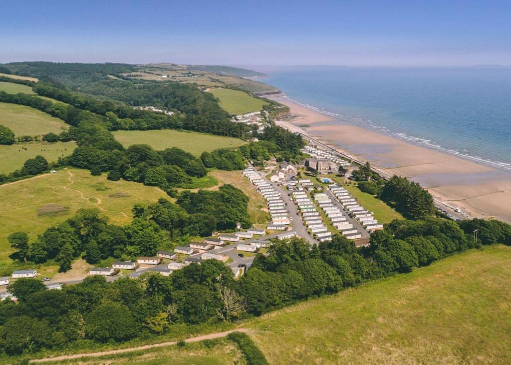 an aerial view of a parking lot next to the beach at Amroth Castle Holiday Park in Amroth