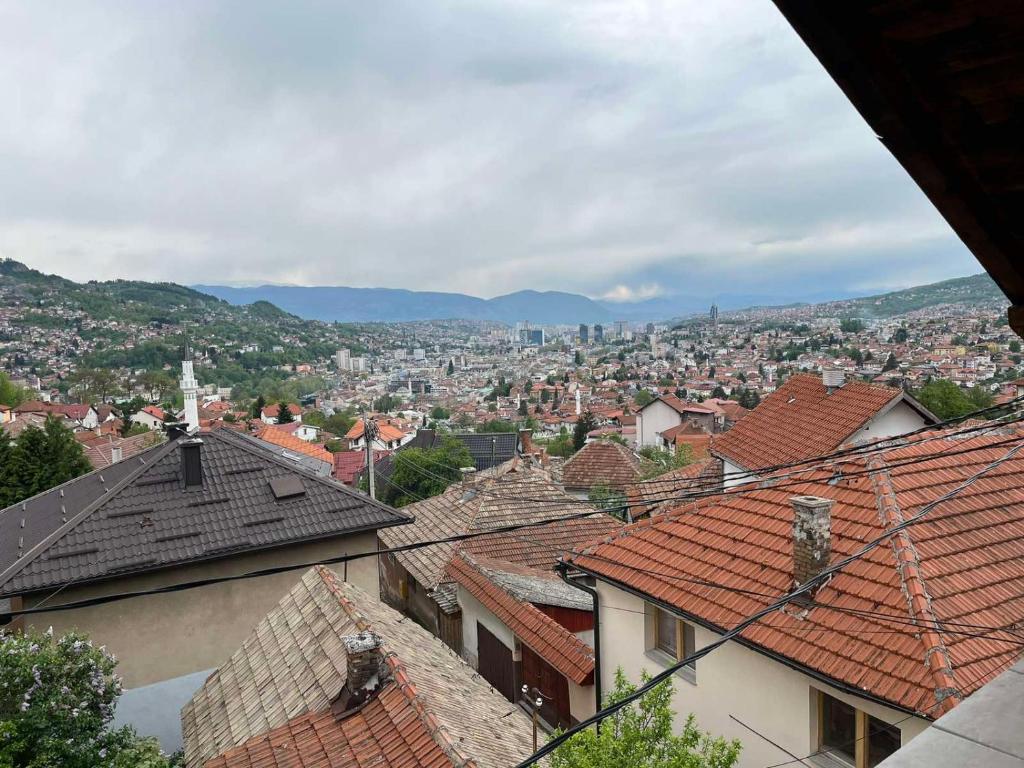 a view of a city from the roofs of houses at Guesthouse Vratnik in Sarajevo
